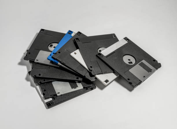 istock Closeup shot of various old floppy disks on white background 1478736689