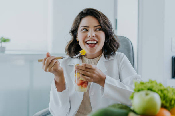 istock Nutritionist eating fruit salad 1478737259