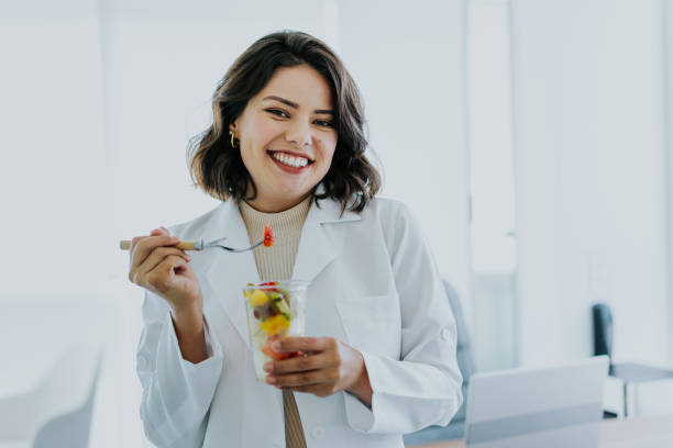 istock Nutritionist eating fruit salad 1478737260