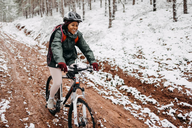 istock Woman rides a bicycle in the forest 1478737264