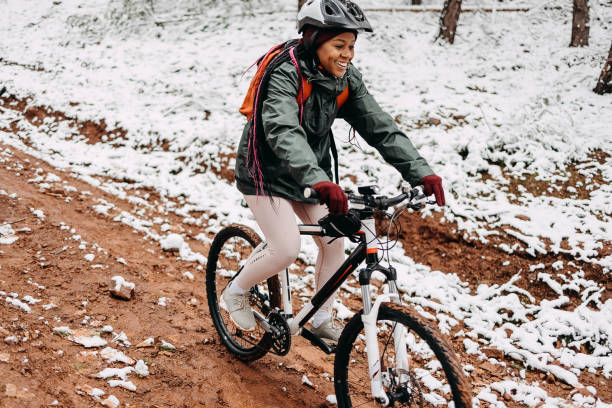istock Woman rides a bicycle in the forest 1478737266