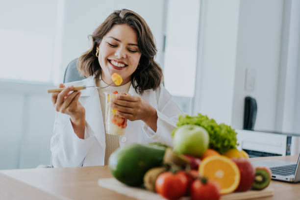 istock Nutritionist eating fruit salad 1478737269