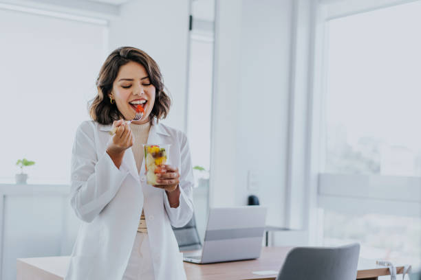 istock Nutritionist eating fruit salad 1478737293