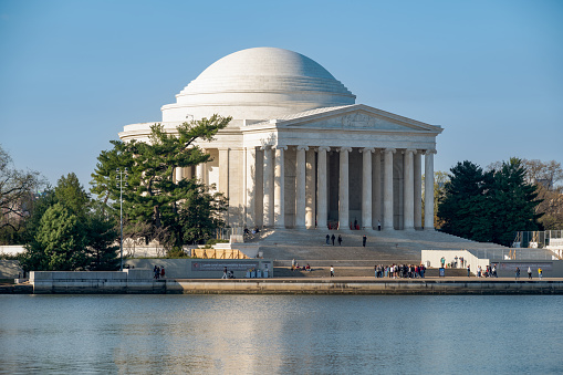 Washington DC, USA - March 27, 2023: The Jefferson Memorial with tourists in Washington DC