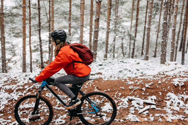 istock Woman rides a bicycle in the forest 1478738008