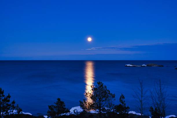 istock Full moon and the reflection in the sea 1478738408