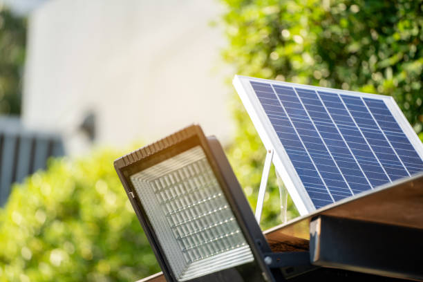 istock Solar Light. Public city light with solar panel powered on blue sky with clouds. Park public lighting pole with photovoltaic panel. renewable energy 1478738848