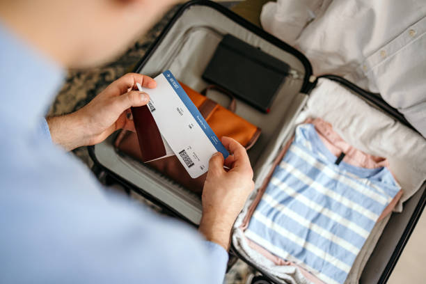 istock Man prepares his luggage for the journey. 1478739244