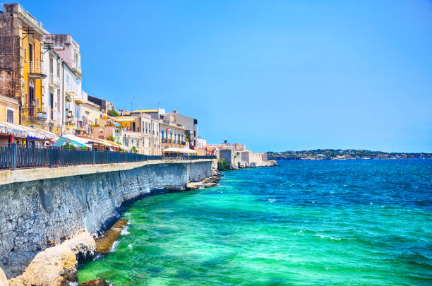 Embankment in Syracuse and the Castello Maniace in the background, Sicily, Italy