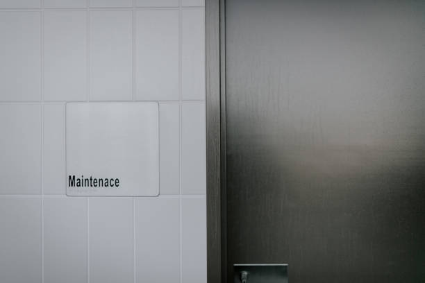 istock Maintenance sign next to a gray door 1478743412