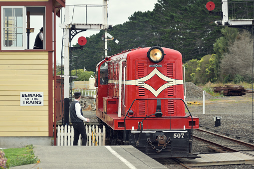Auckland, New Zealand – January 17, 2021: View of English Electric DE507 diesel locomotive pulling train at Glenbrook Vintage Railway