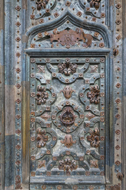 istock Vertical closeup of a baeutiful ornament on a wall 1478744466