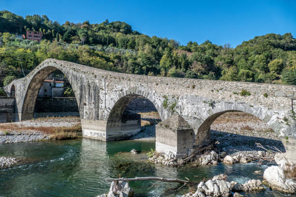istock Ancient stone bridge, the medieval Ponte Maddalena, or Devils Bridge, in Tuscany 1478745541