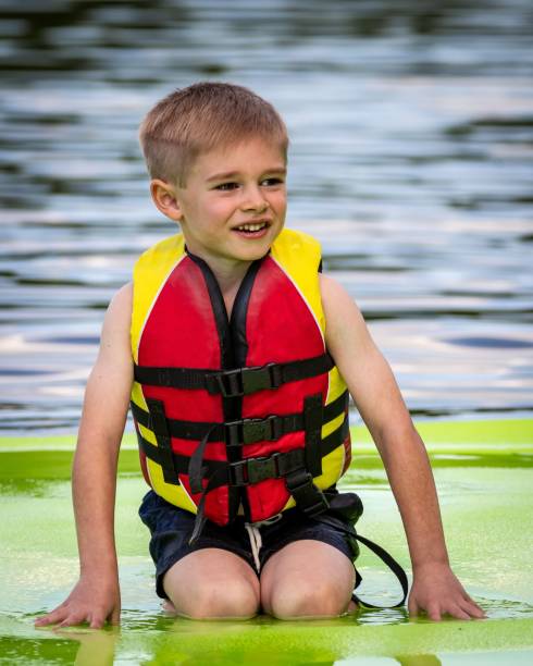 istock Blond boy wearing a life jacket 1478749660