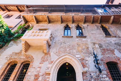 Verona, Italy-June 12, 2023; Stone balcony of Juliet’s House in Gothic-style, said to have inspired William Shakespeare for his tragic play Romeo and Juliet