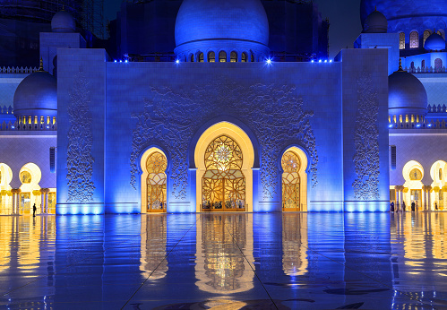 Abu Dhabi, UAE - February 27. 2023: Sheikh Zayed Grand Mosque with illumination in the evening, Abu Dhabi.