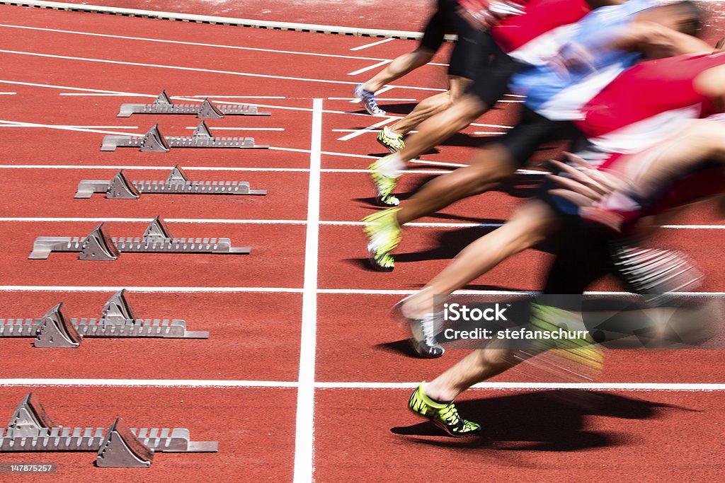 sprint start in track and field athletes in sprint start in track and field Starting Line Stock Photo