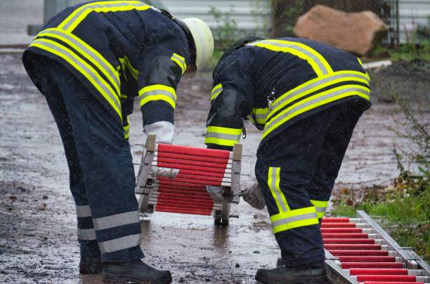 istock Two firefighters connect a pluggable and portable aluminum fireman's ladder 1478753972
