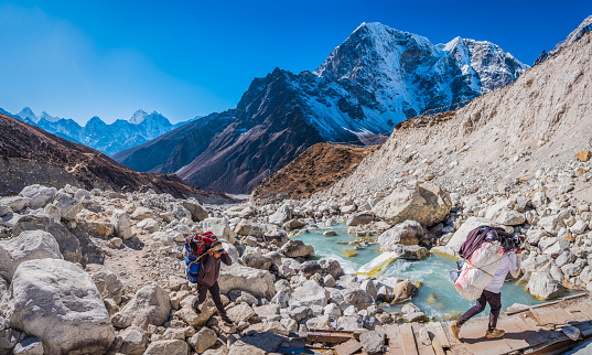 Mount Ama Dablam and other high mountains reaching out of a sea of fog, Nepal.