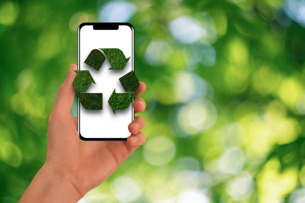 istock Man is holding a phone with green recycling symbol 1478755108