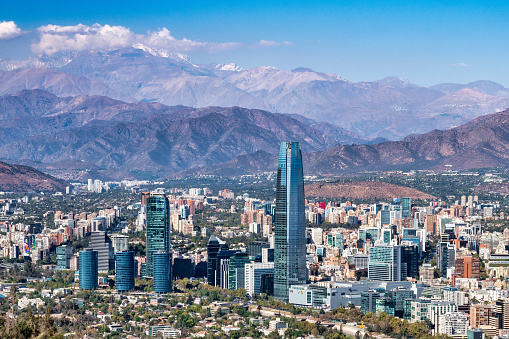 Experience the stunning skyline and cityscape of Santiago, Chile, captured in this panoramic photo. The vibrant capital city is nestled in the foothills of the Andes, offering a unique blend of urban and natural beauty. From the iconic skyscrapers and historic landmarks to the lush green spaces and bustling streets, Santiago is a feast for the senses. This image is the perfect addition to any travel or tourism campaign, showcasing the stunning beauty and unique character of this vibrant city.