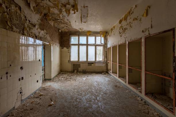 istock View looking down the corridor into an abandoned building with paint smeared on the walls 1478757556