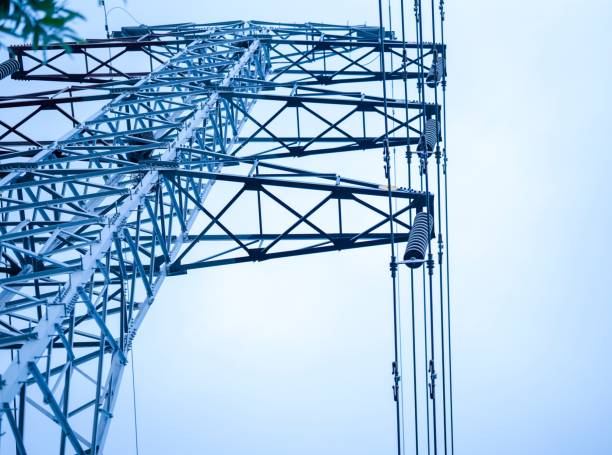 istock Low angle of a high Transmission tower  with blue sky 1478760762