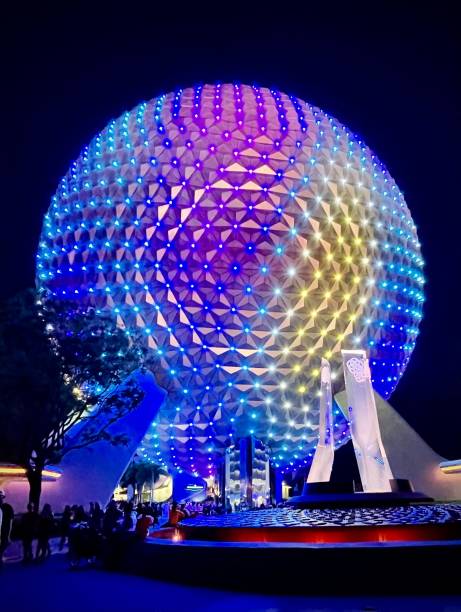 Space Ship Earth at night Orlando, United States – June 02, 2022: Vertical photo of Spaceship Earth all light up as the park is closing disney world stock pictures, royalty-free photos & images