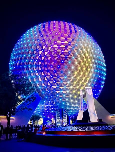 Space Ship Earth at night Orlando, United States – June 02, 2022: Vertical photo of Spaceship Earth all light up as the park is closing epcot stock pictures, royalty-free photos & images