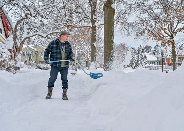 istock A man shoveling sidewalk in the morning 1478763409