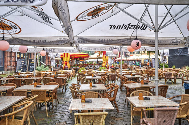 Berlin, Germany – October 08, 2019: Berlin, Germany - October 8, 2019: Deserted restaurant with orphaned tables in downtown Berlin.
