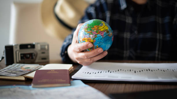 istock Close-up Woman planning vacation with world map 1478767519