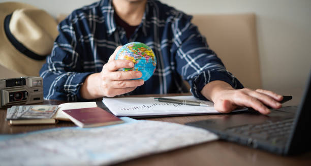 istock Close-up Woman planning vacation with world map 1478767560