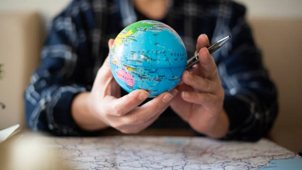 istock Close-up Woman planning vacation with world map 1478767579