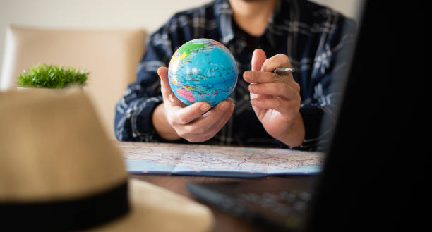 istock Close-up Woman planning vacation with world map 1478767597
