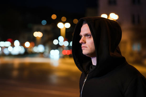 istock Depressed, lonely man walking the night streets alone and thinking 1478769611