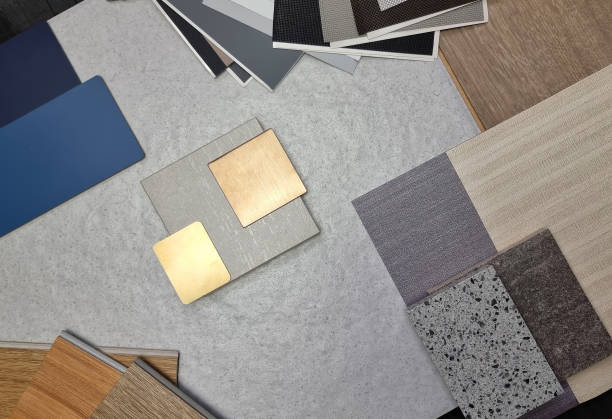 istock combination of interior material board samples contains gold stainless, travertine tile, roller blind drapery swatch, wooden vinyl flooring tile, interior fabric wallpaper, quartz, laminate. top view. 1478771734