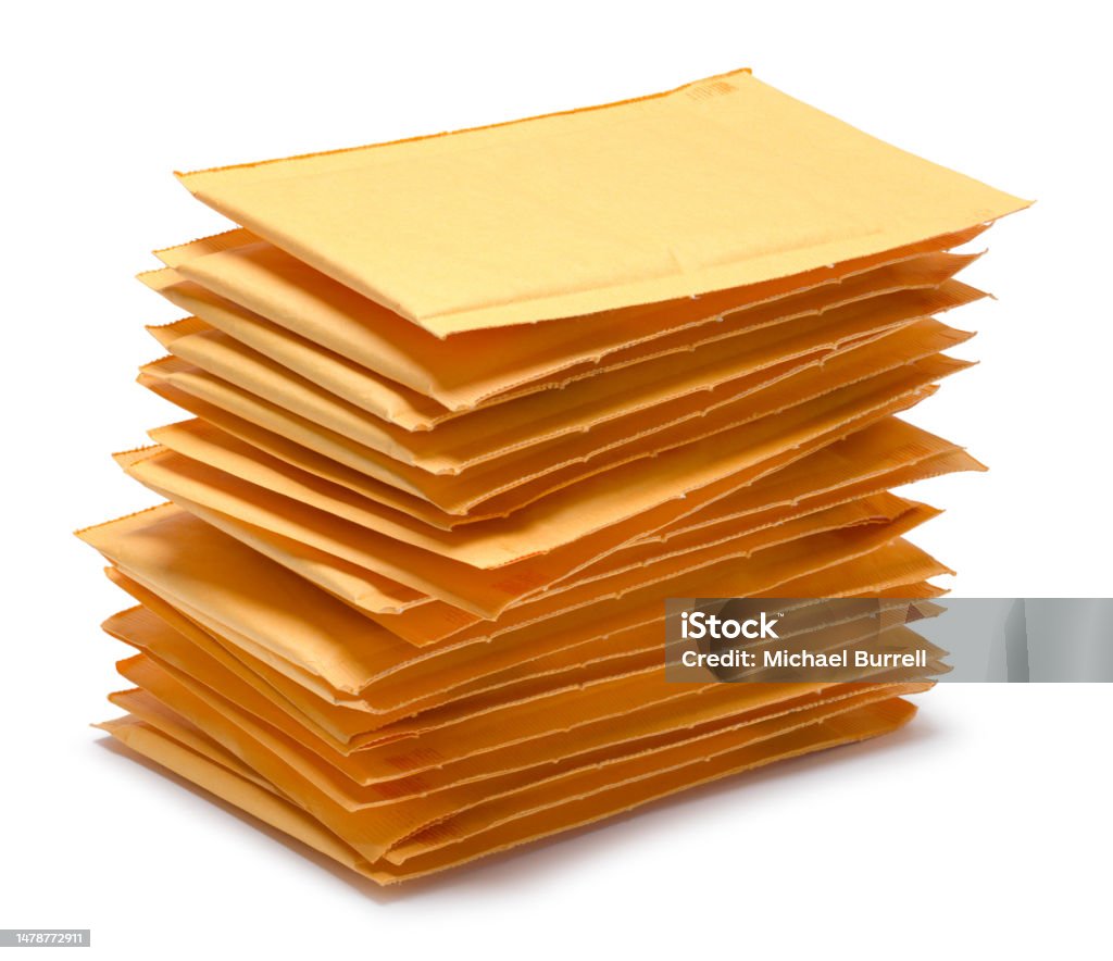 Padded Envelope Stack Pile of Yellow Padded Envvelopes Cut Out on White. Color Image Stock Photo