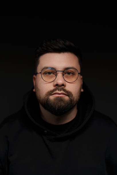 istock Confident bearded man in eyeglasses on black background 1478774368