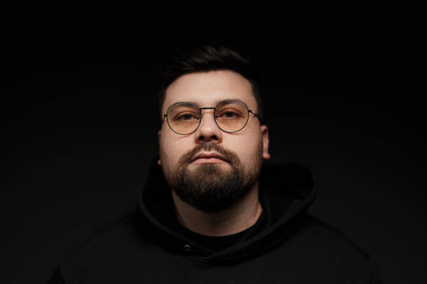 istock Confident bearded man in eyeglasses on black background 1478774369