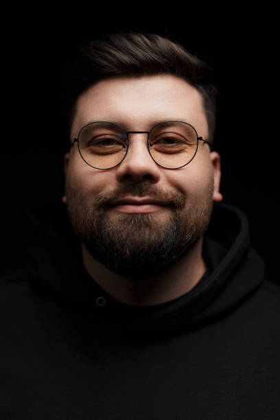 istock Confident bearded man in eyeglasses on black background 1478774372
