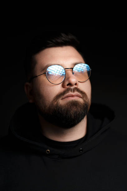 istock Confident bearded man in eyeglasses on black background 1478774467