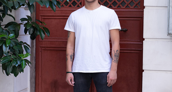 blank white t-shirt on young male on the street. fashion mockup