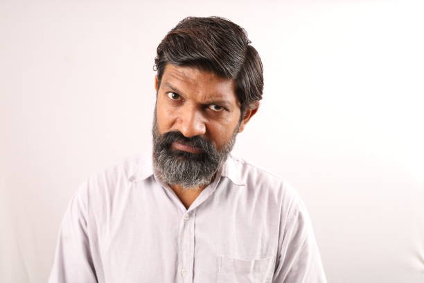 istock White background studio shoot of angry Indian bearded man 1478782029