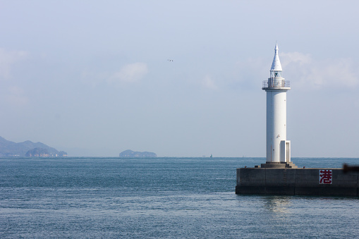 A lighthouse in the harbor in