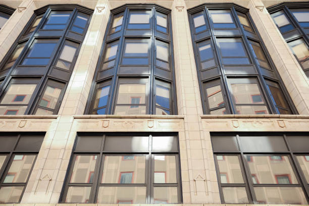 istock stone buildings with large windows symbolizes stability and strength with a connection to nature. Stone represents durability, while large windows convey openness and a desire for natural light 1478788240