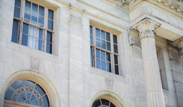 istock stone buildings with large windows symbolizes stability and strength with a connection to nature. Stone represents durability, while large windows convey openness and a desire for natural light 1478788241