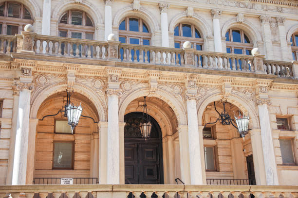 istock stone buildings with large windows symbolizes stability and strength with a connection to nature. Stone represents durability, while large windows convey openness and a desire for natural light 1478788257