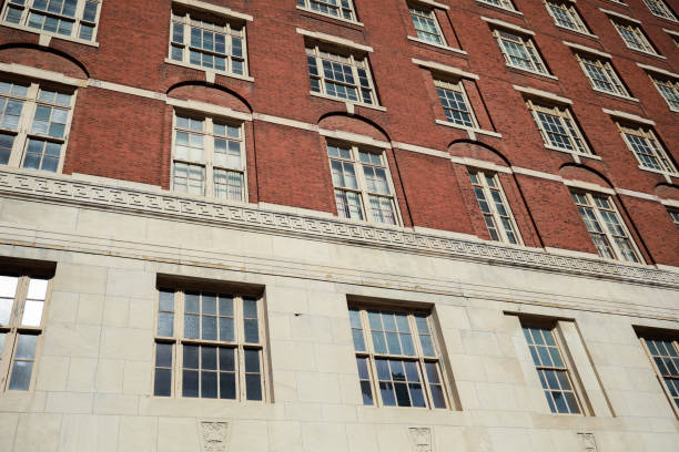 istock stone buildings with large windows symbolizes stability and strength with a connection to nature. Stone represents durability, while large windows convey openness and a desire for natural light 1478788261