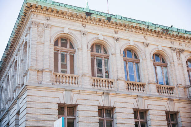 istock stone buildings with large windows symbolizes stability and strength with a connection to nature. Stone represents durability, while large windows convey openness and a desire for natural light 1478788266